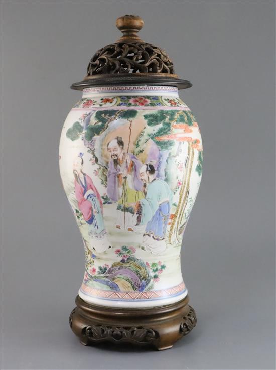 A Chinese famille rose baluster vase, Yongzheng period, H. 27cm, reduced in height from a yen yen vase, wood cover and stand